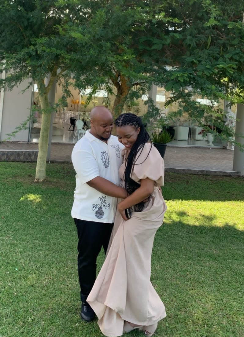 Naledi and Nkanyiso laughing together in the garden